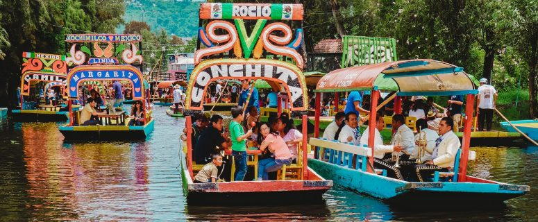 people riding tour boats during daytime in mexico