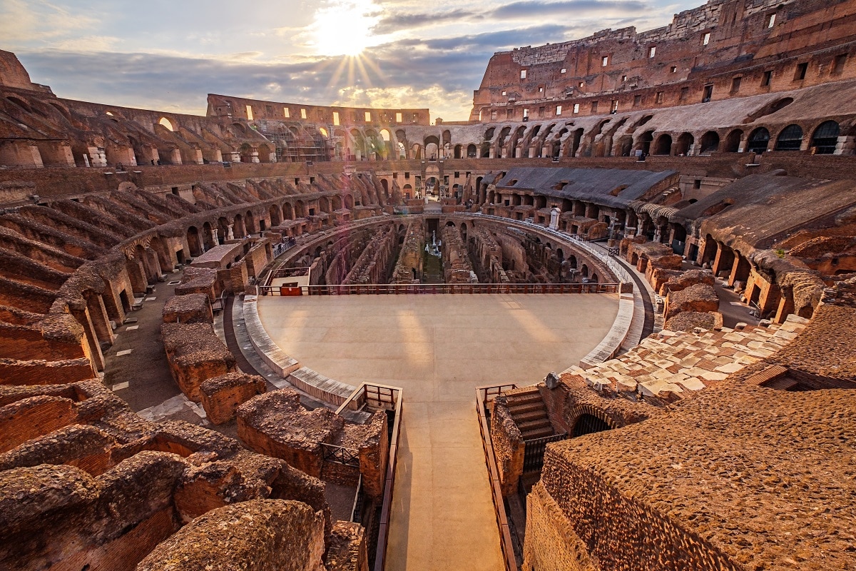 Scenic view of Roman Colosseum interior at sunset, Rome Italy