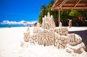 Sand castle on a white tropical sandy beach