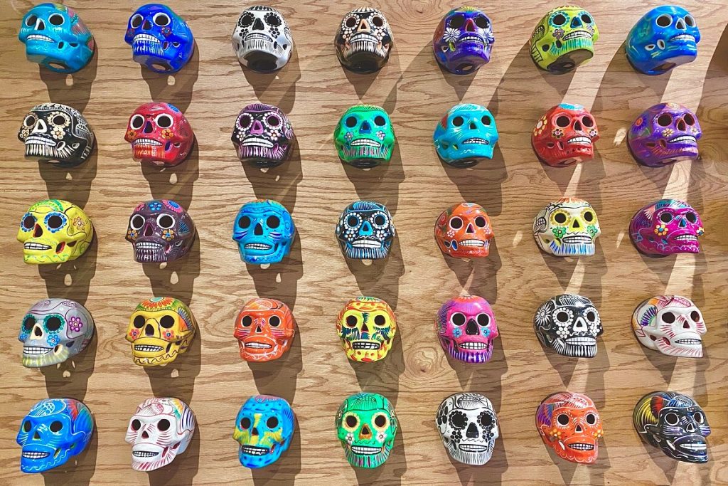 Colorful Flatlay Background of Painted Mexican Skulls