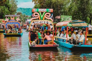 people riding tour boats during daytime in mexico