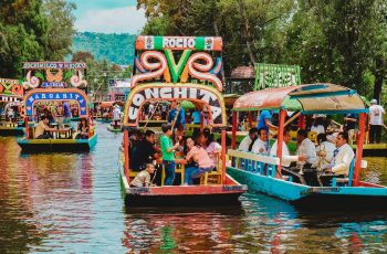 people riding tour boats during daytime in mexico