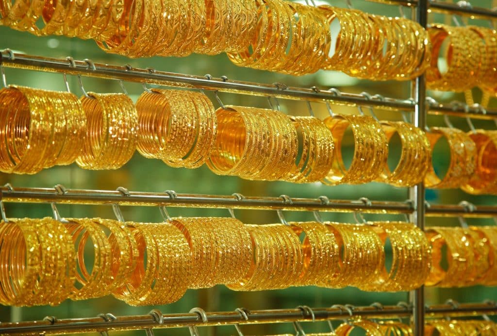 golden bangles on stainless steel rack